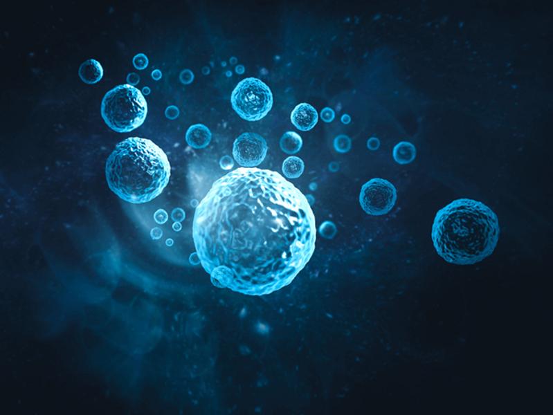 Blue microscopic cells floating in a dark background, illustrating cellular biology.